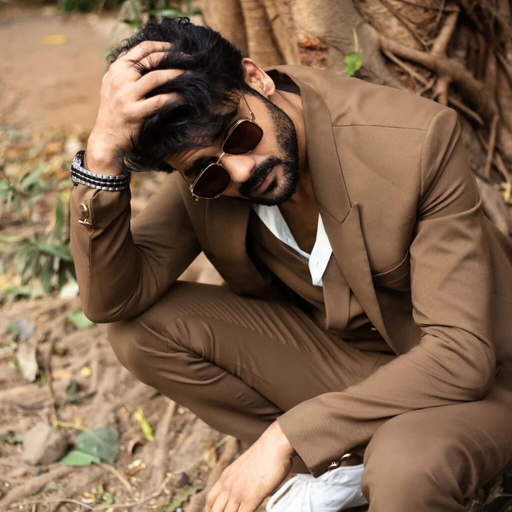 Vishal Aditya Singh in light brown suit with white shirt and goggles posing for camera - most handsome tv serial actor in india