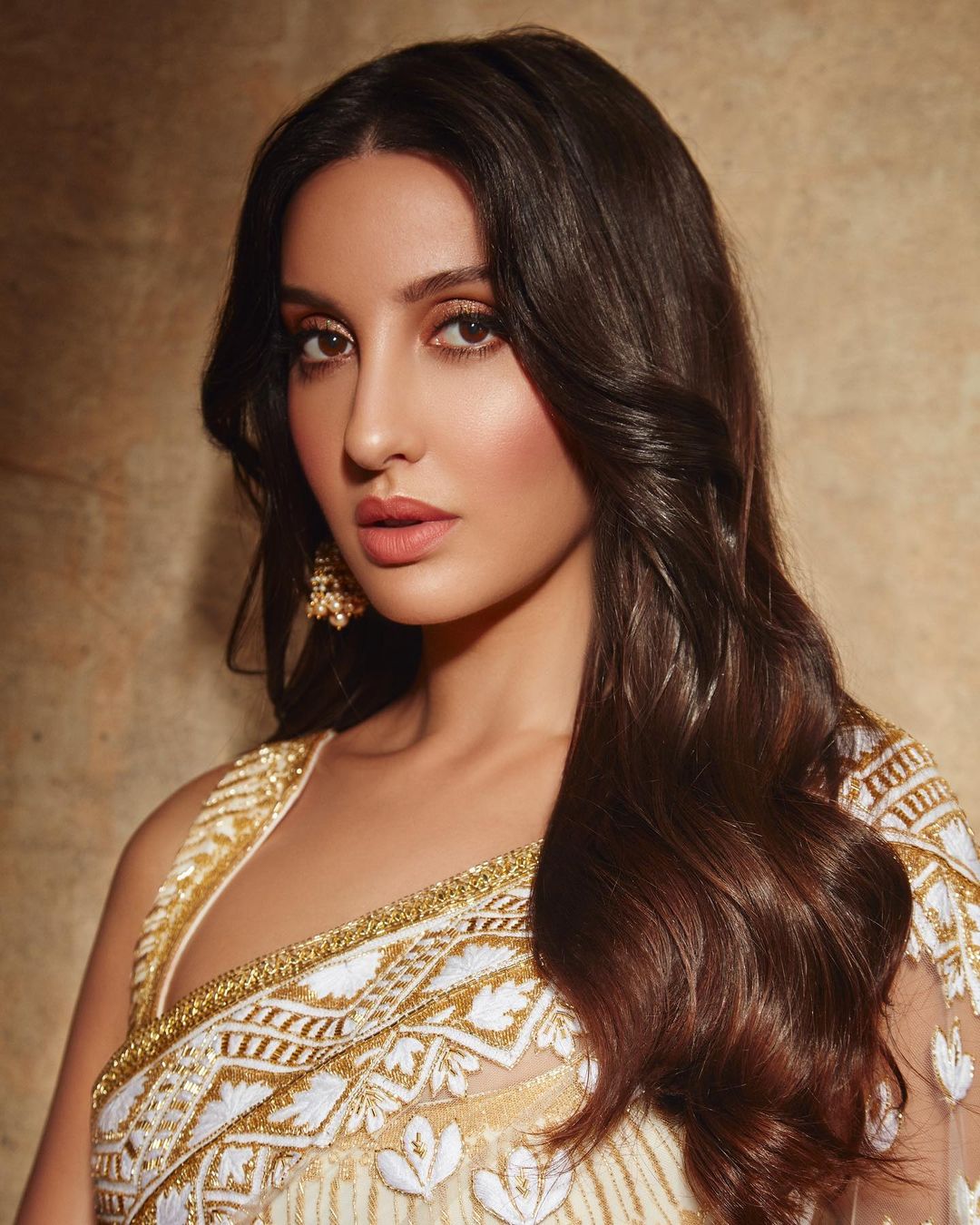 Nora Fatehi in white and golden saree with jhumka earrings - beautiful indian girl instagram photos