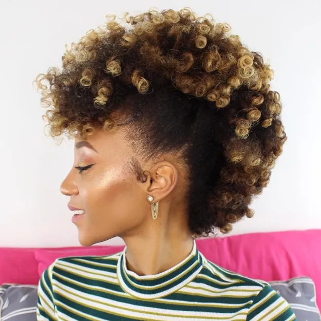 A girl in multicolor lining high neck dress posing for camera and showing her 
 African-American Ombre Frohawk - American Women's haircuts