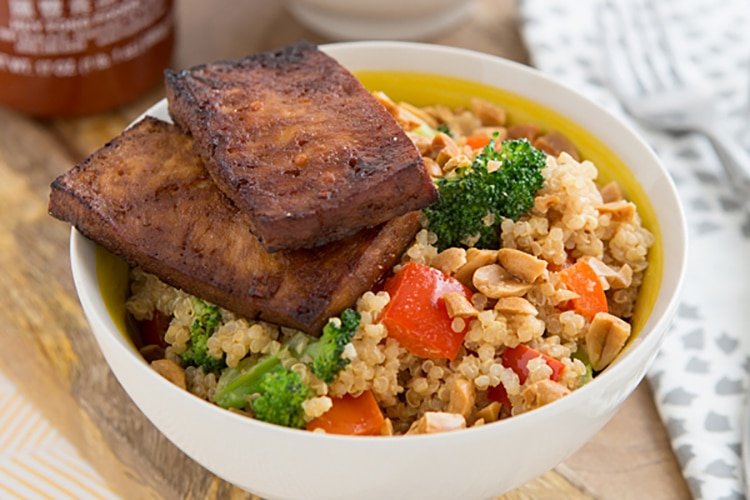 Peanutty Quinoa Bowls with Baked Tofu serves in a white bowl - high in protein vegetarian meals