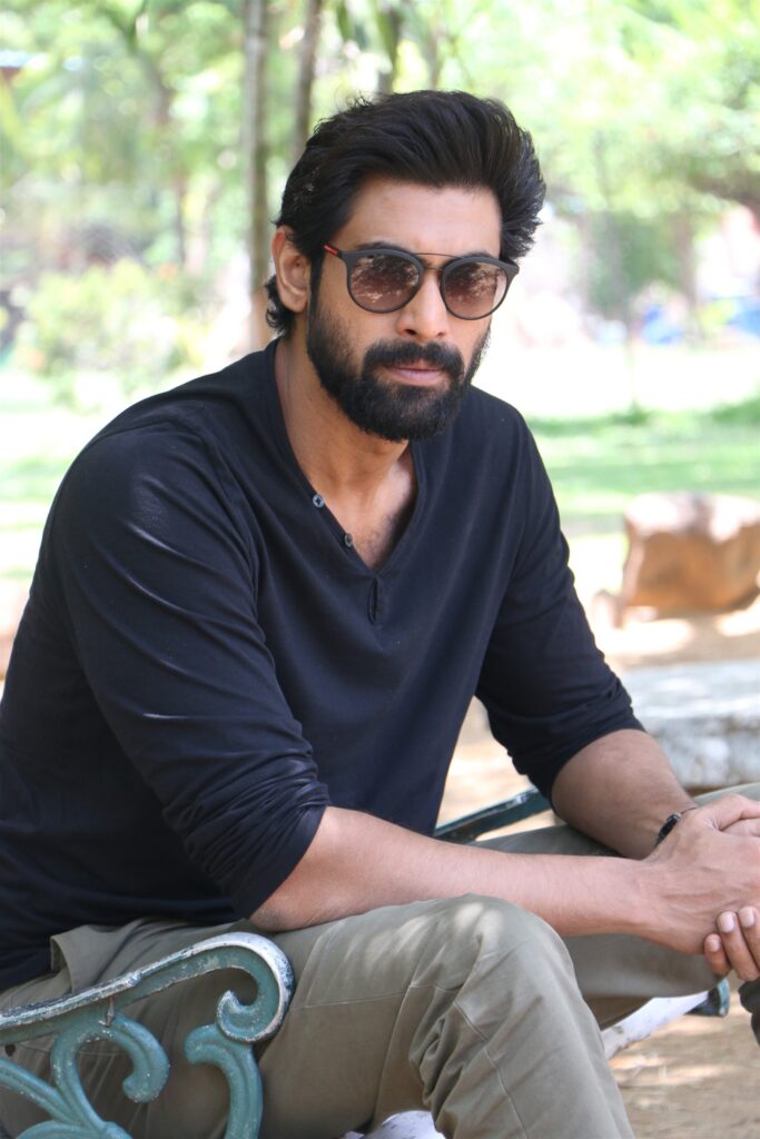 Rana Daggubati in blue full sleeves t-shirt with grey trouser and goggles siting on a bench - indian celebrities with diabetes type 2
