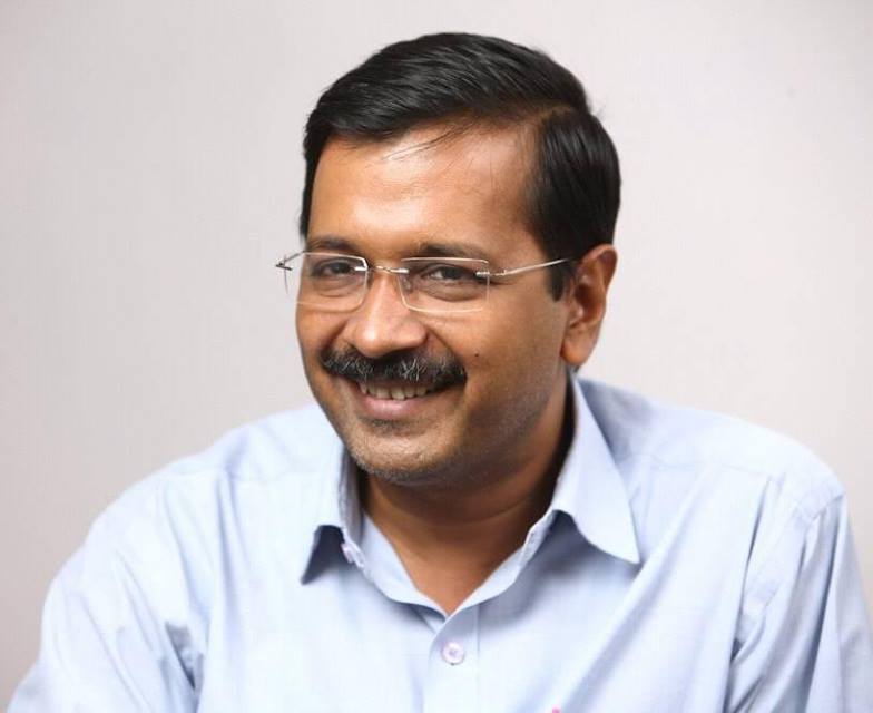 Smiling Arvind Kejriwal in sky blue shirt with spectacles - indian celebrities with diabetes 