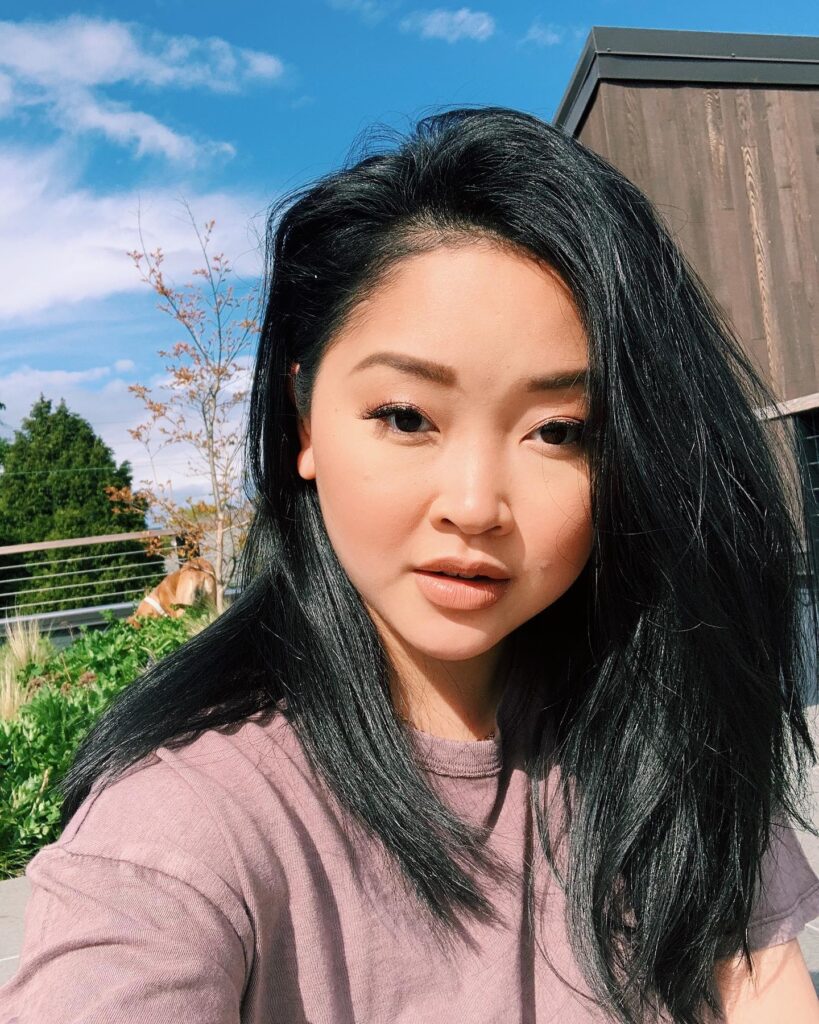 Lana Condor in pink round neck t-shirt posing for selfie - hollywood actresses short hair