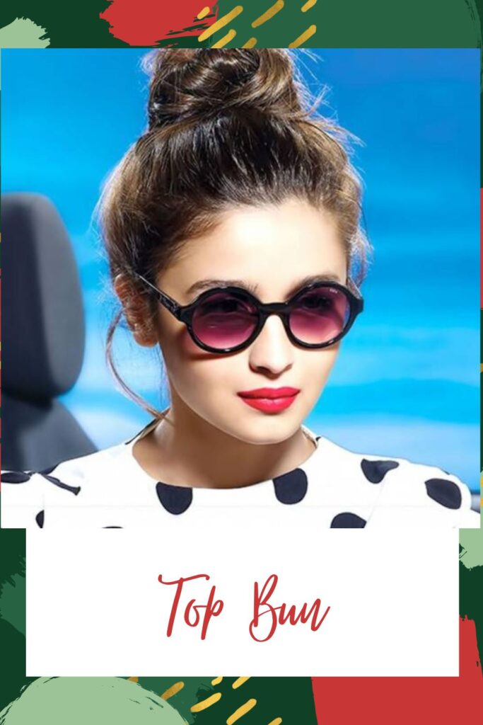 Alia Bhatt in black and white dotted dress with goggles and red lipstick showing her top bun - Indian hair cut names