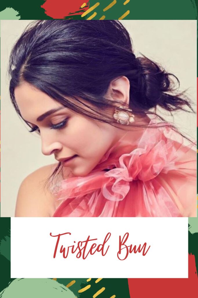 A girl in pink cut sleeves top and floral earrings posing for camera and showing the side view of her Twisted Bun A girl in pink cut sleeves top and floral earrings posing for camera and showing the side view of her Twisted Bun - Hairstyles for Indian Women