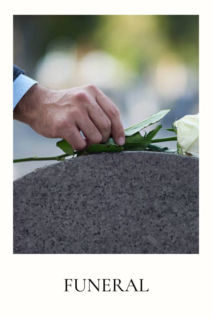 Someone is putting flowers on the grave - planning a funeral