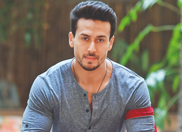 Tiger Shroff in grey round neck full sleeves t-shirt and war movie hairstyle - shroff hairstyle name