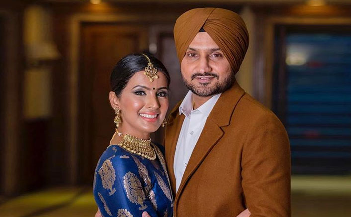 Harbhajan Singh and Geeta Basra in traditional outfit posing for camera - wives of indian cricketers