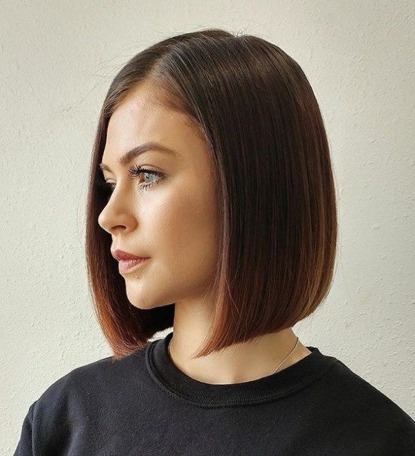 Woman in black round neck sweatshirt and Blunt Bob haircut - popular hairstyles for women