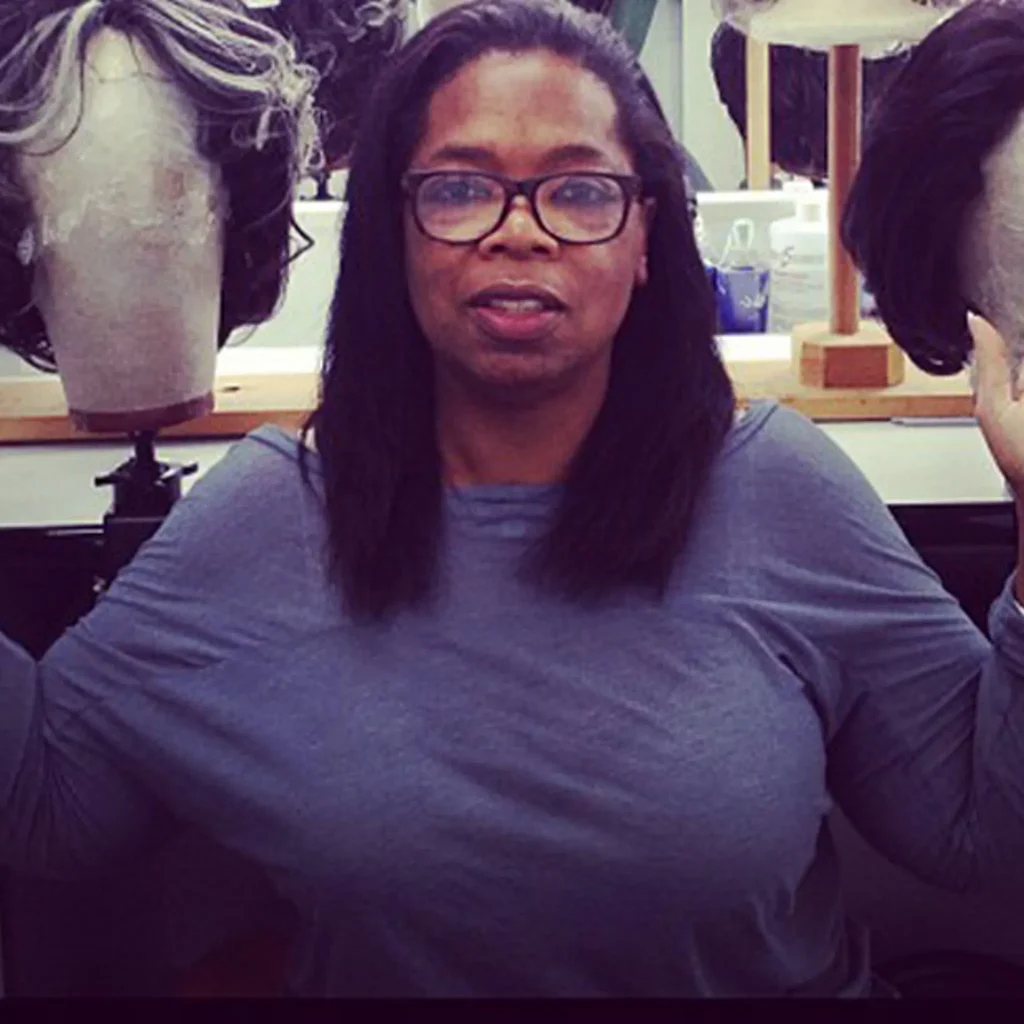 Oprah Winfrey in blue full sleeves top with spectacles - black celebrities without makeup 