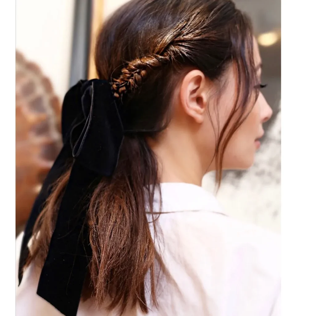 Woman in pink shirt and The Accessorized pony - 2022 trendy haircuts