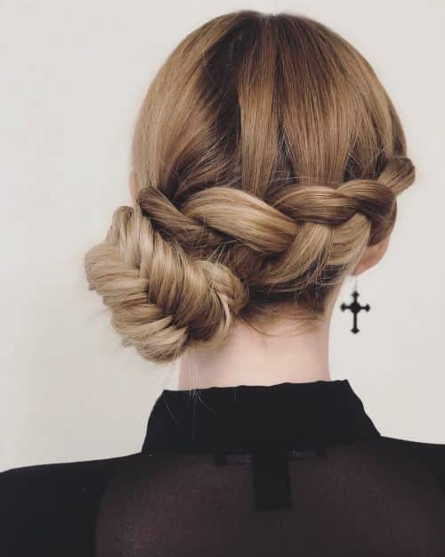 A women in black shirt showing the back view of his Side Bun hairstyle - professional hairstyles for women