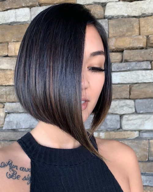 A girl in black cut sleeves top showing the side view of her Short hair with Extreme Side Parting hairstyle - hairstyle for women