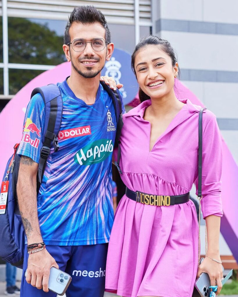 Yuzvendra Chahal and Dhanashree Verma together posing for camera - wives of indian cricketers
