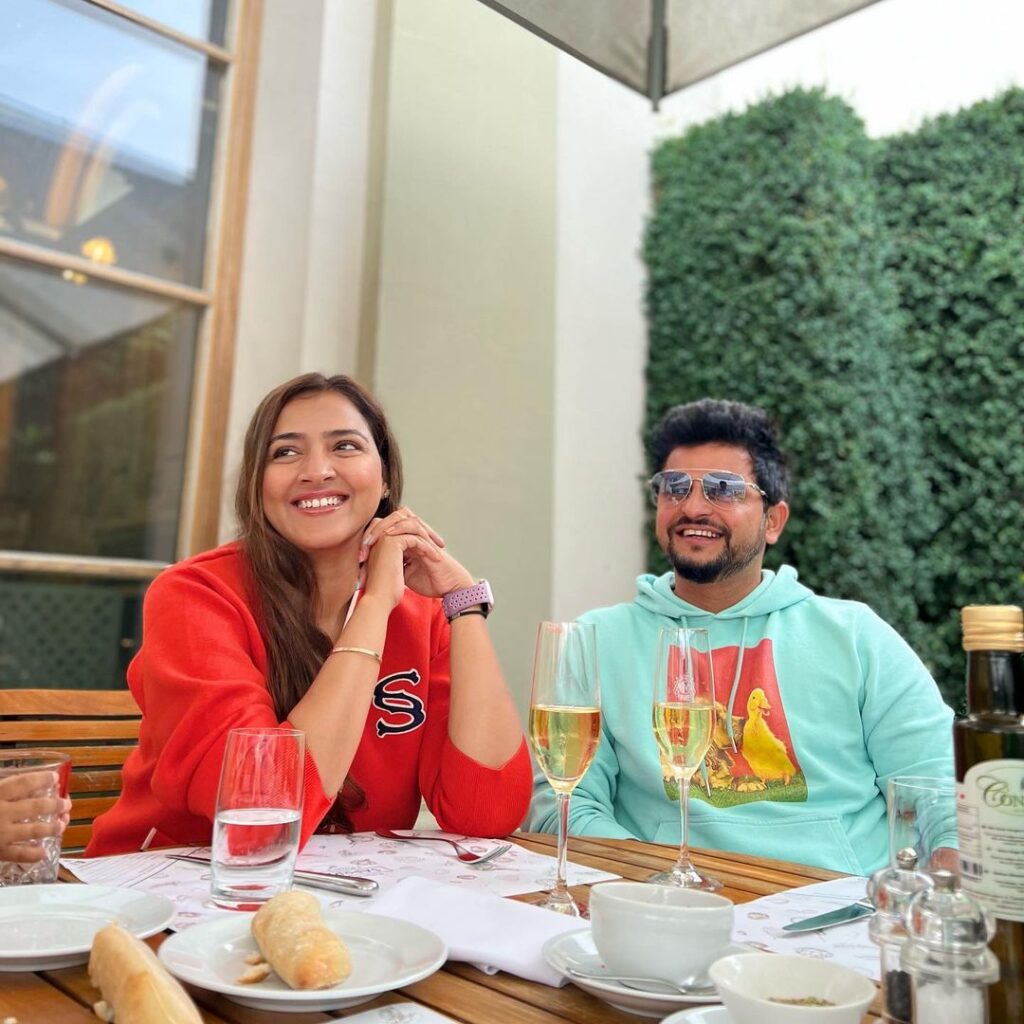 Suresh Raina and Priyanka Chaudhary Raina sitting and having breakfast - indian cricketers wife photos