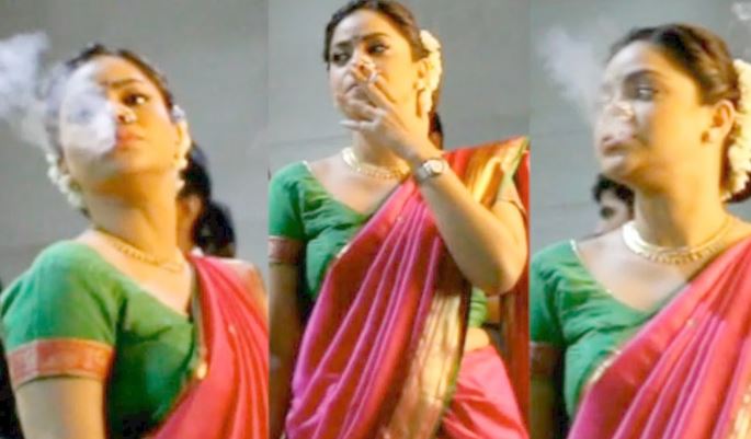 Sumona Chakravarti smoking pics in pink saree with green blouse and gajra in her bun - indian tv actress smoke