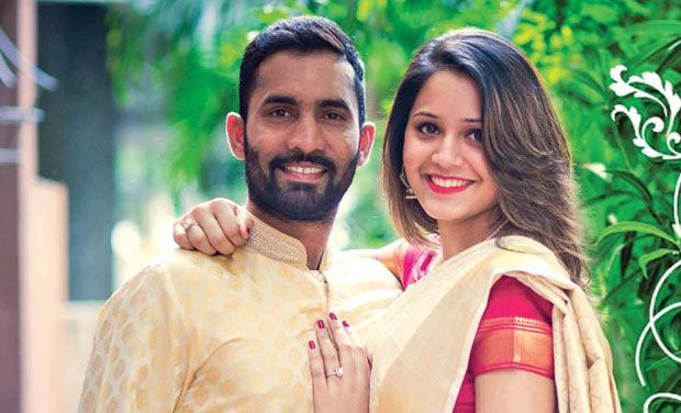 Dinesh Karthik and Deepika Pallikal smiling and posing for camera - indian cricketers wives and girlfriends