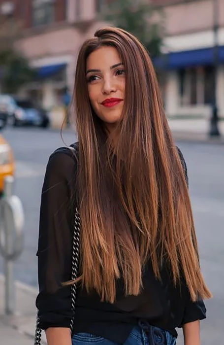 Woman in black dress with red lipstick and Long Straight Hair - haircuts for long straight hair indian