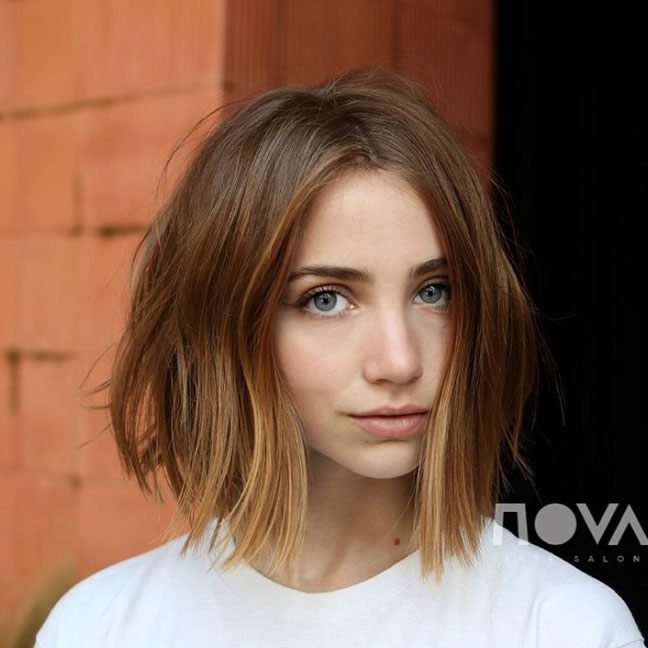 Woman in white t-shirt and Super blunt bob hairstyle - ladies hairstyle 2022