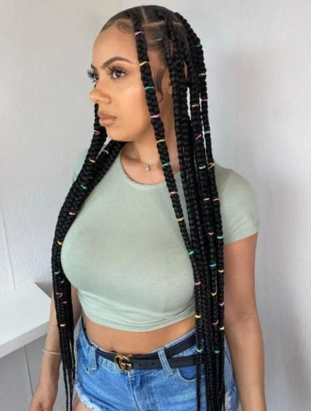 Woman in grey crop top with blue shorts and Long Box Braids hairstyle - easy hairstyles for straight long hair