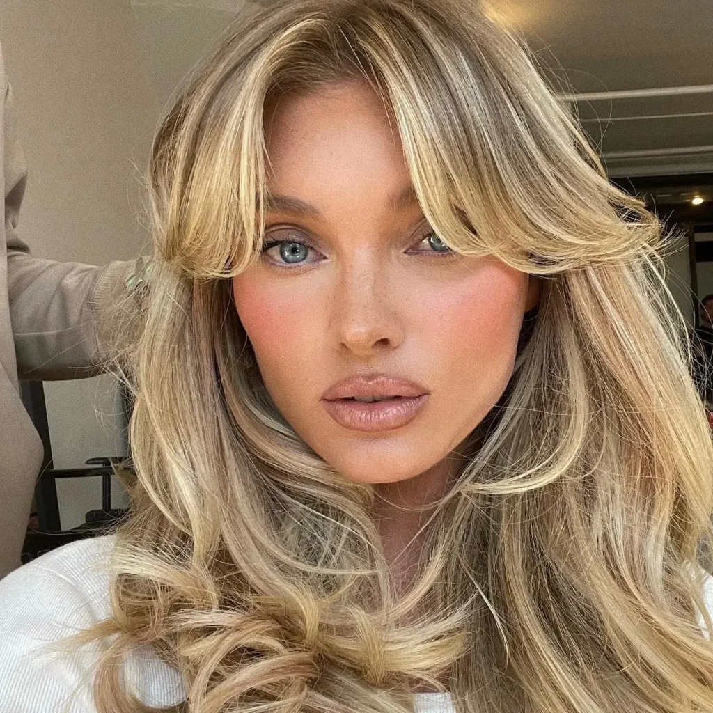 woman showing her Chandelier layers hairstyle - long haircut 2022 women