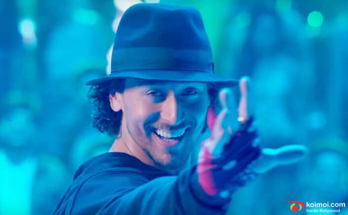 Tiger Shroff dancing and wearing a hat - hairstyle tiger shroff