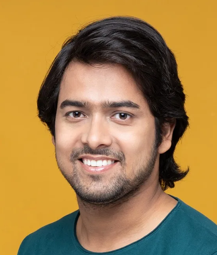Smiling man in blue t-shirt and straight Shag Hair Style Smiling man in blue t-shirt and straight Shag Hair Style - hairstyles for Indian boys