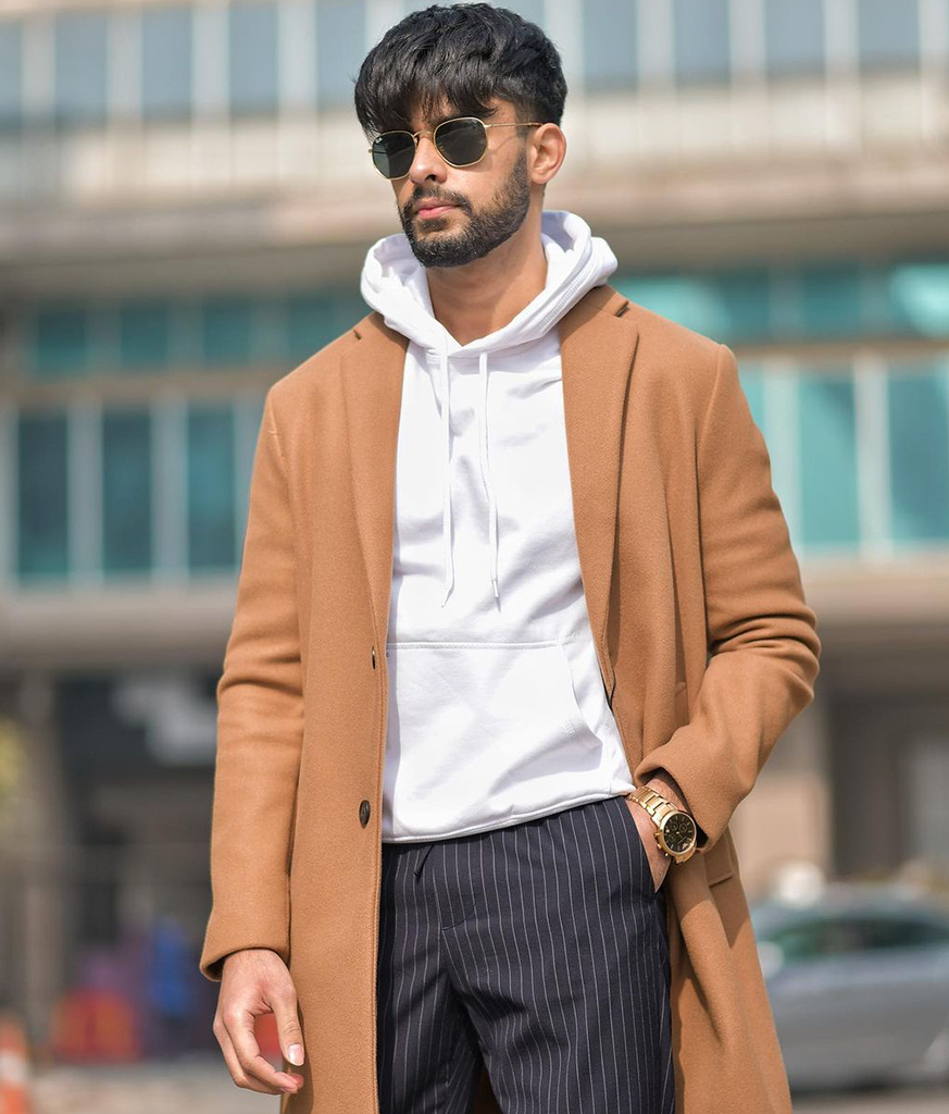 Man brown coat with white inner with googles and fringe haircut Man brown coat with white inner with googles and fringe haircut - hairstyles for Indian boys