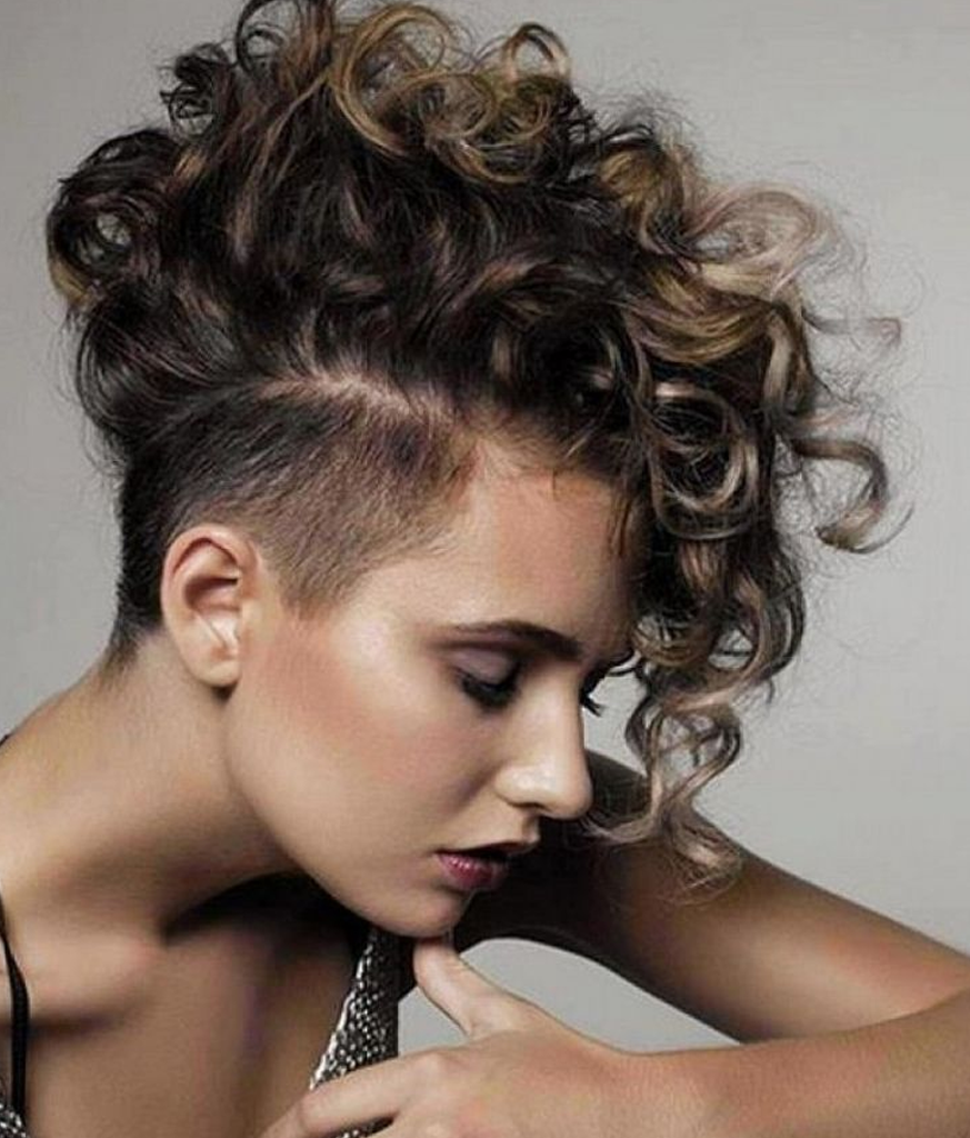 Woman in silver strappy dress and Curly Mohawk hairstyle - 
