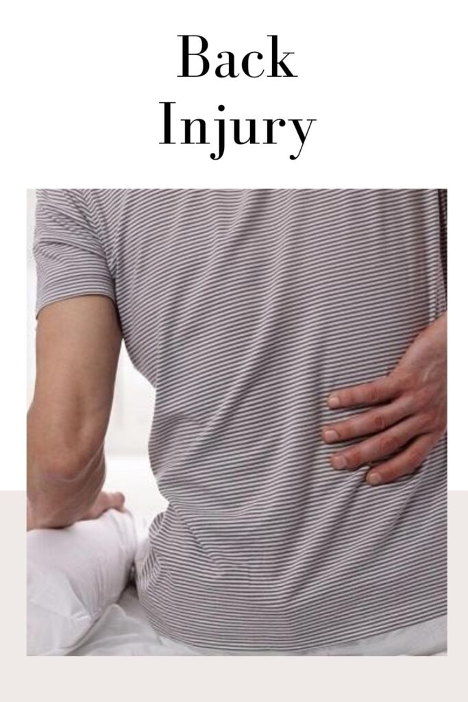Man in black and white lining t-shirt suffering from back ache - back injury