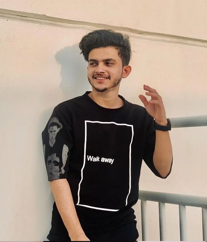 Man in black half sleeves t-shirt and Brush Up haircut Man in black half sleeves t-shirt and Brush Up haircut - simple hairstyle for Indian boy