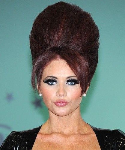 Woman in black dress and The Modern Bun from the 60s hairstyle - 2022 trendy haircuts