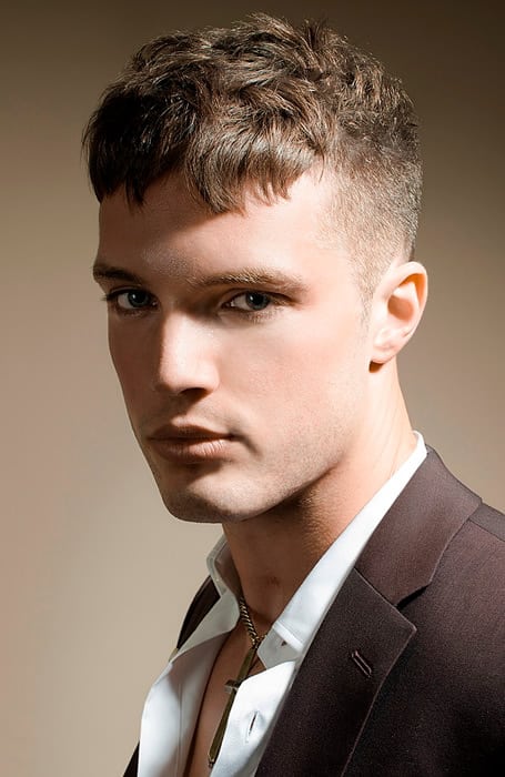 Man in brown coat and white shirt with Caesar Cut hairstyle - mens haircuts list