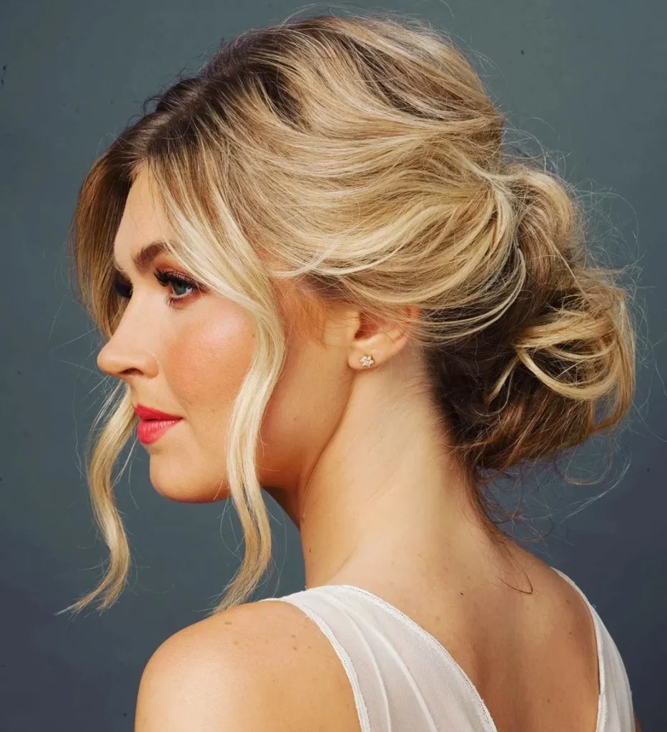 Woman in pink lipstick and The Romantic Bun hairstyle - hairstyle 2022 female