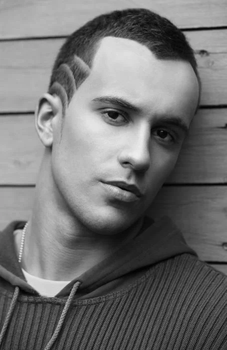 Man in grey pullover and Hair Design hairstyle - mens haircuts list