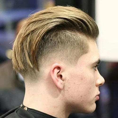 man in Long Textured Slick Back Fade hairstyle - best haircut for guys
