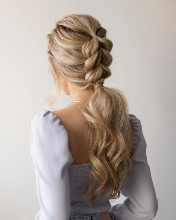 Woman in sky blue dress and Elegant Braid and Ponytail hairstyle - haircuts for long hair