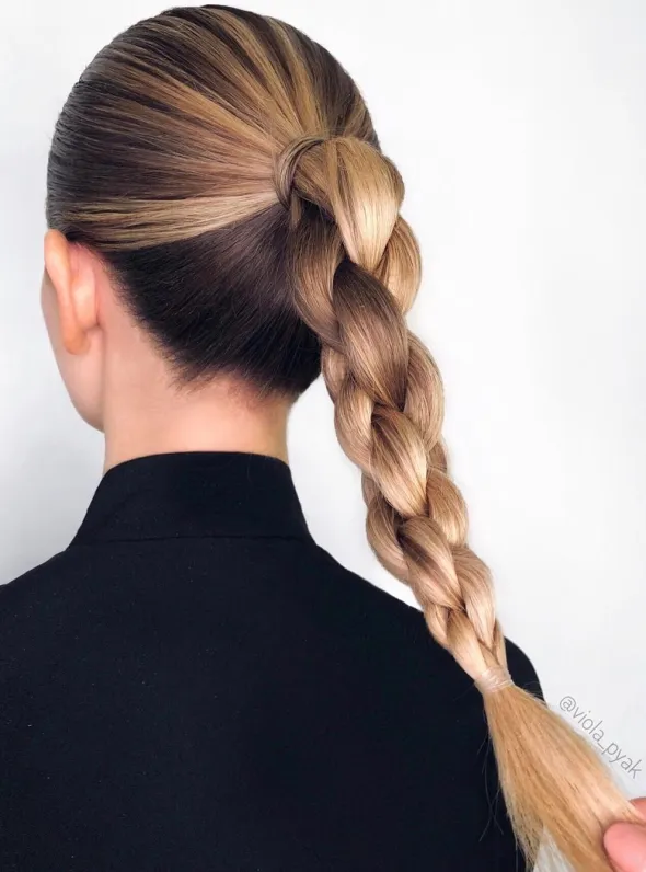 Woman in black shirt showing the back view of her Quick and Easy Braided Updo - long hair hairstyle ideas