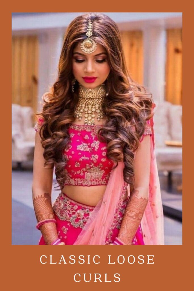 Woman in pink lehenga with golden jewellery and Classic Loose Curls hairstyle - Open curls and waves hairstyle