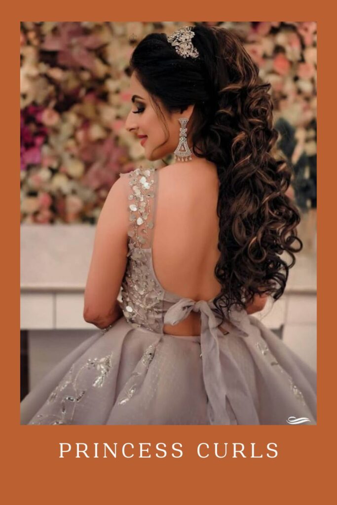 Woman in grey sequence deep neck dress and Princess Curls hairstyle - open hairstyles for lehenga
