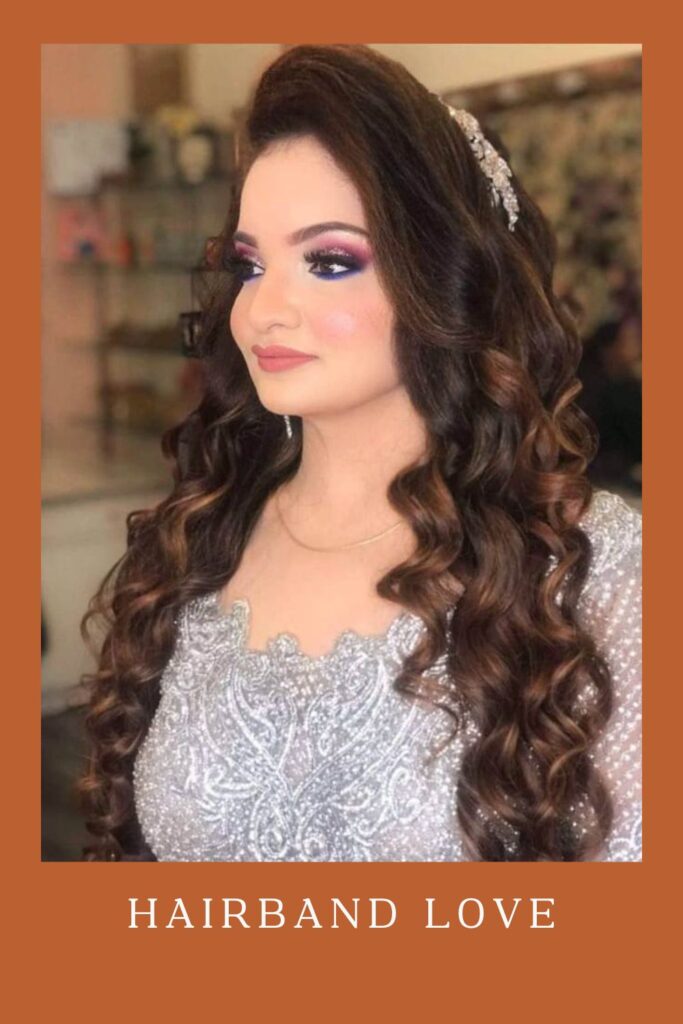 Woman in white shiny dress with Hairband Love hairstyle - Curly Hairstyles for lehenga