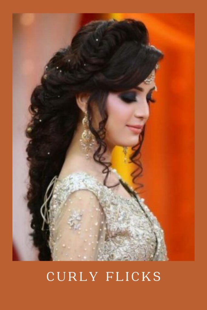 Woman in off white lehenga  and Curly Flicks hairstyle - curly hair for lehenga