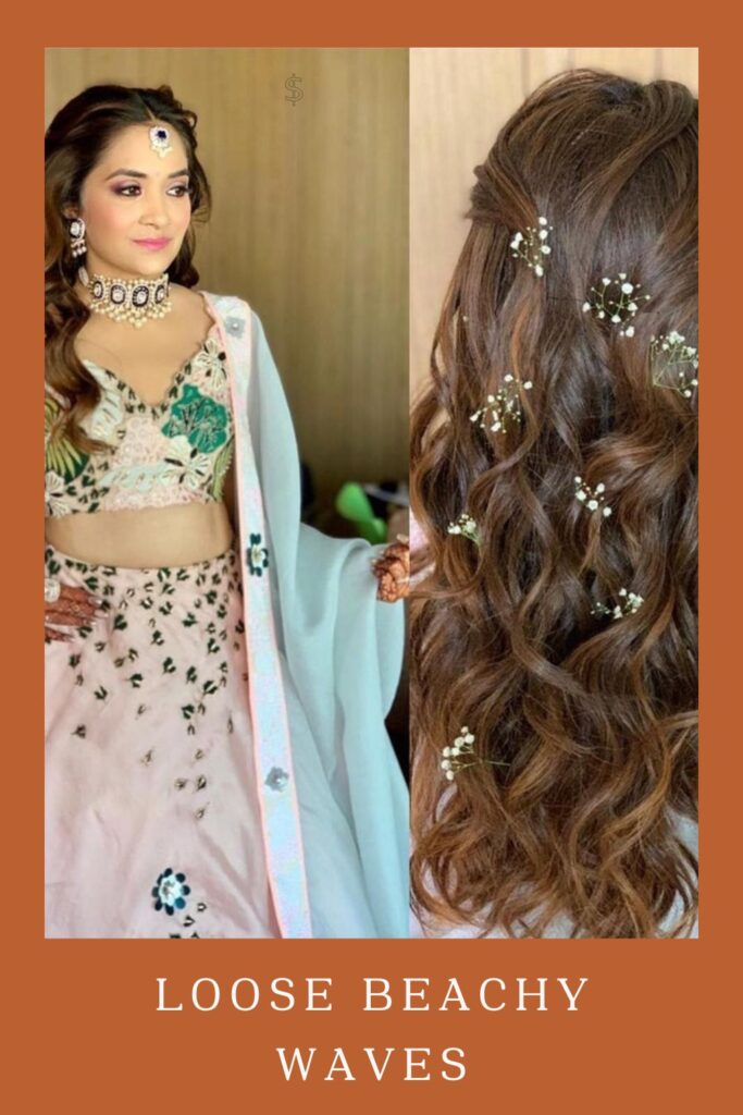 Loose Beachy Waves saç modeli ile eşleşen mücevherlerle pembe ve yeşil lehengalı kadın -Hint düğünü için lehenga kıvırcık saç modelleri