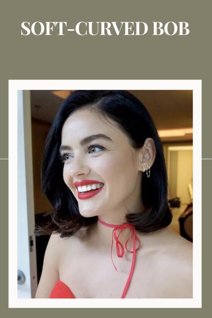 Smiling woman in red off shoulder dress and Soft-Curved Bob hairstyle - hairstyles for women