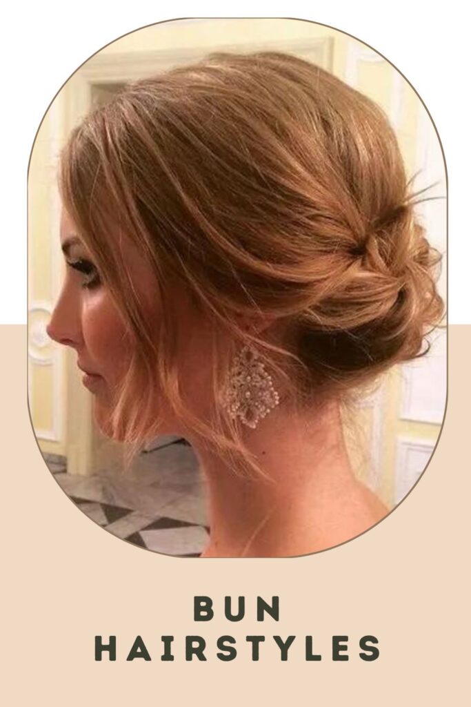 Woman wearing long sliver earrings with Bun Hairstyles - short hair up ideas