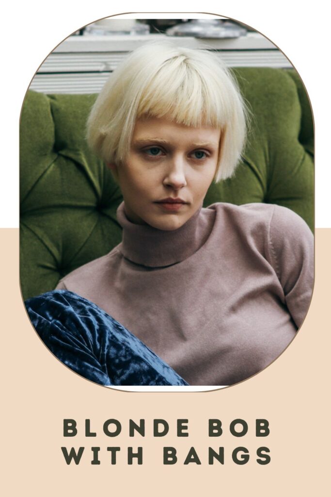 Woman in purple high neck top and Blonde bob with bangs hairstyle Woman in purple high neck top and Blonde bob with bangs hairstyle - best short hairstyles