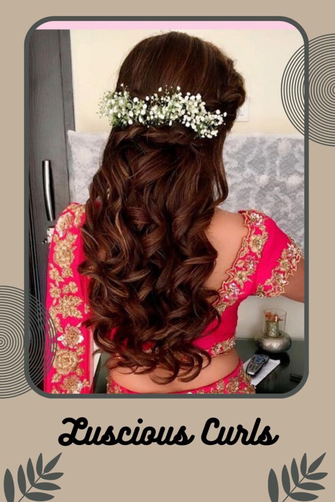 Woman in pink saree and showing the back view of her Luscious curls - wedding hairstyles for very short hair