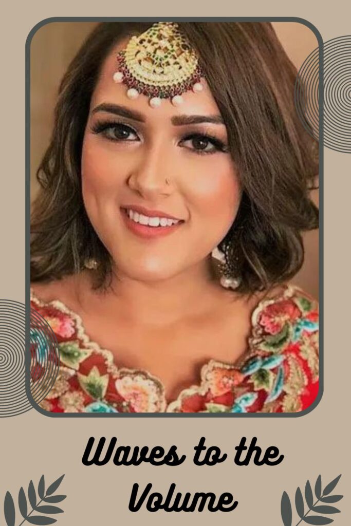 Smiling woman in multicolor traditional dress with Waves to the volume hairstyle Smiling woman in multicolor traditional dress with Waves to the volume hairstyle - best hairstyles for Indian hair