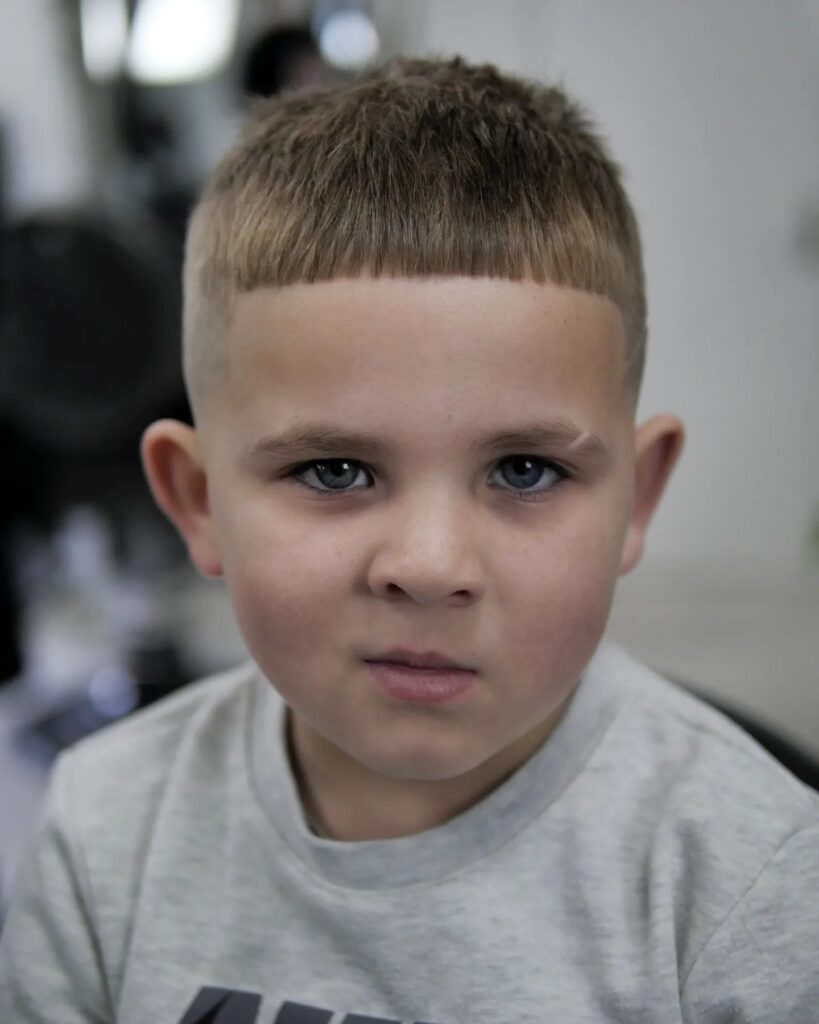 Boy in printed t-shirt showing his Textured Crop hairstyle Textured Crop Hairstyle